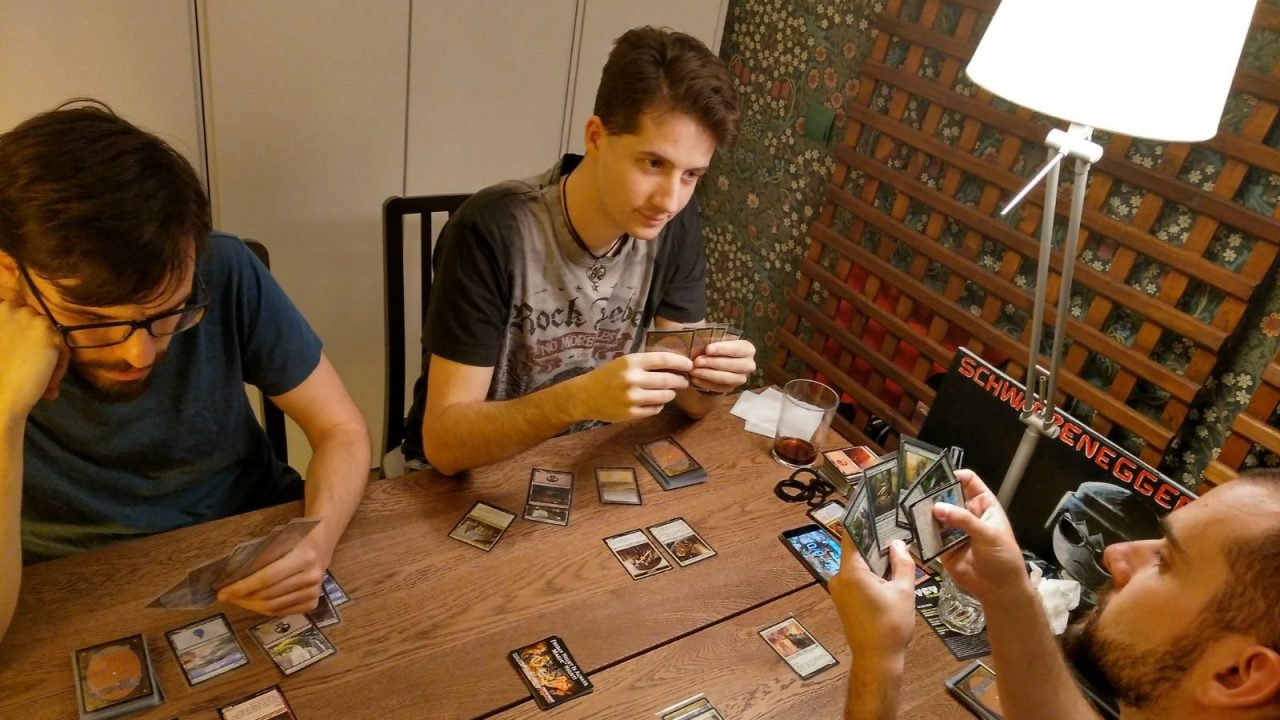 Group of players with cards on the table during a Magic: The Gathering draft