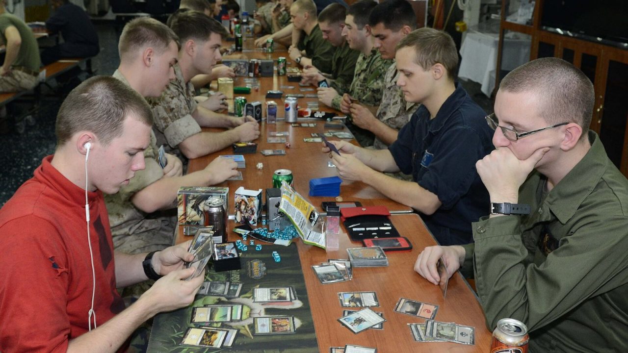 Players at tables during a Magic: The Gathering tournament