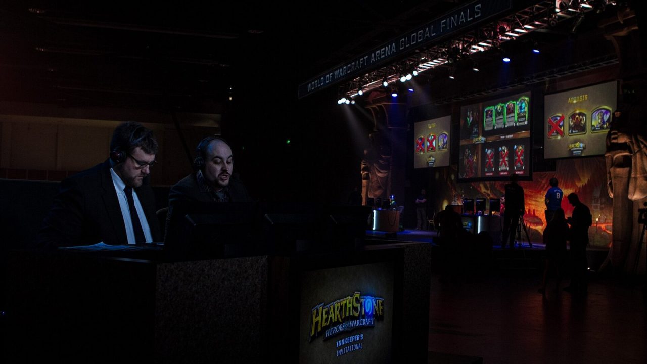 Hearthstone casters commentating a match on stage at BlizzCon 2013