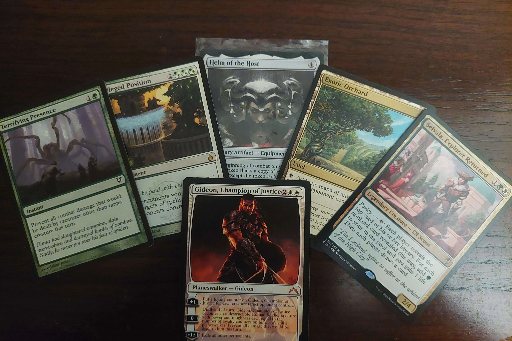 Magic: The Gathering cards of several types laid out side by side